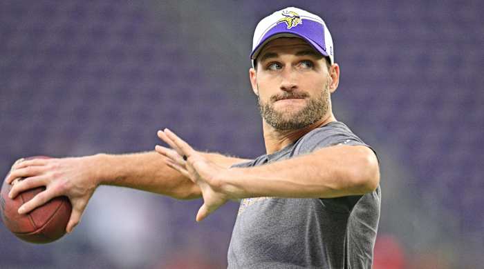 Kirk Cousins throws the football during warmups